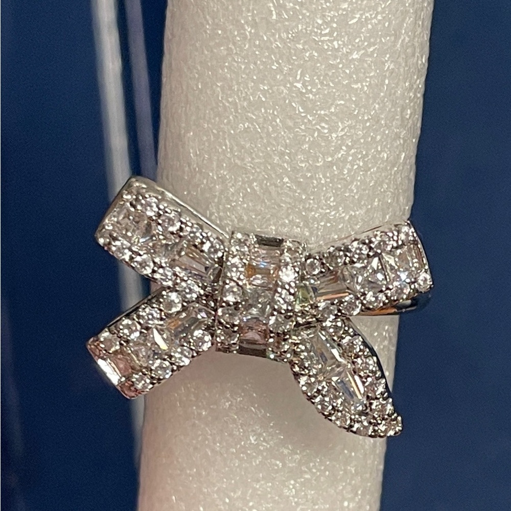 Elegant Silver Bow Ring very blingy!!
New Condition 
Size 7.5